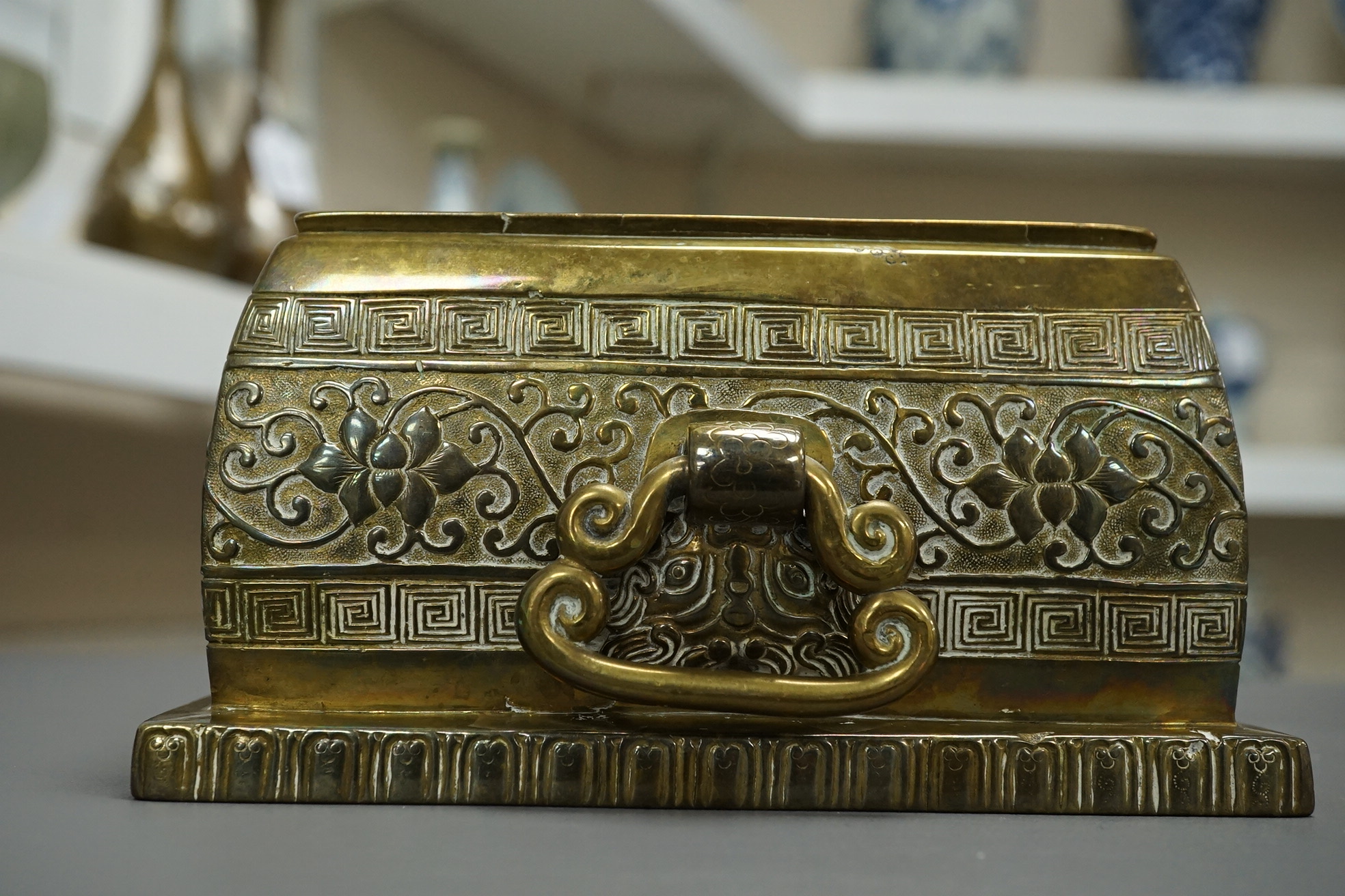 A large Chinese bronze rectangular censer and cover, Xuande seal mark, and a ‘plum blossom and chilong’ bronze censer, both 19th century